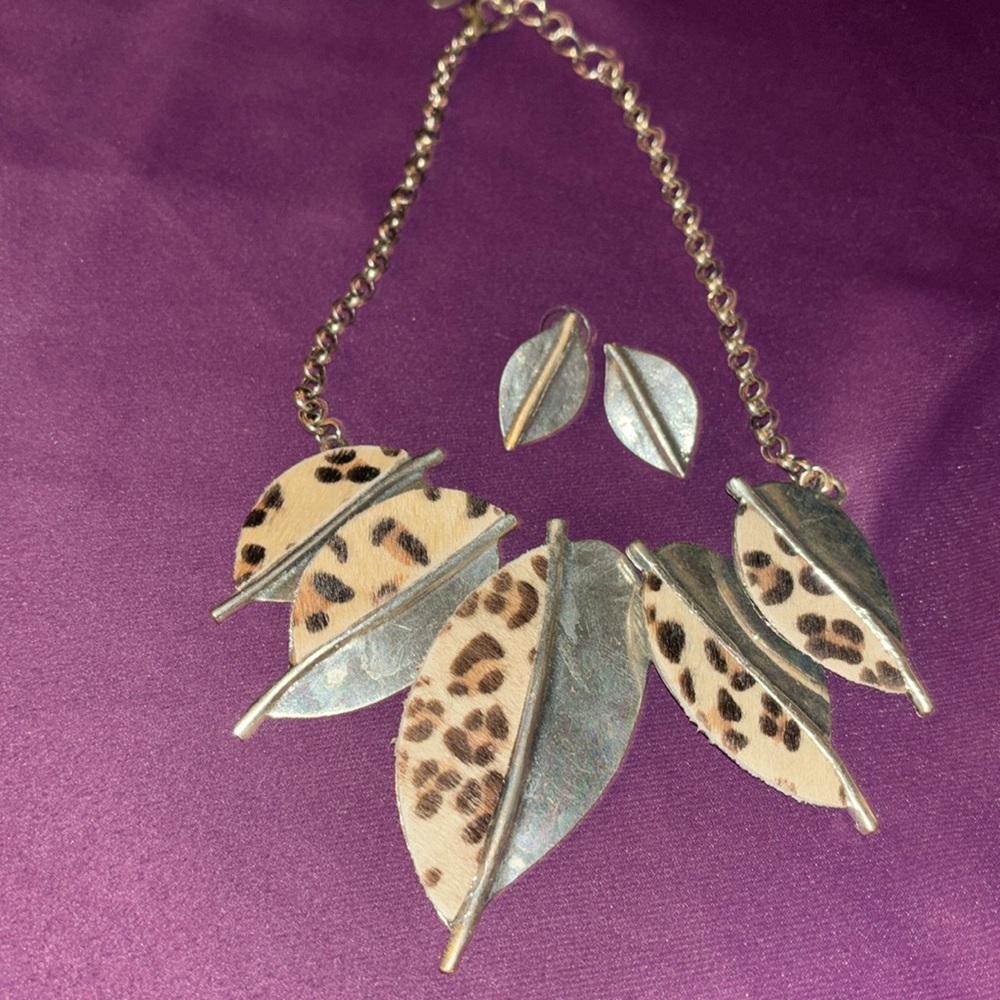 Leopard print feather looking necklace earring set.